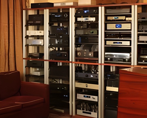 Wall of equipment racks filled with amplifiers and sources