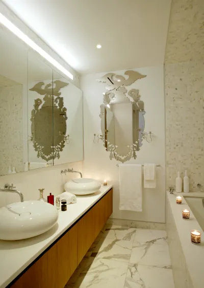 Marble bathroom with discreet audio at New York's Waterfall Mansion